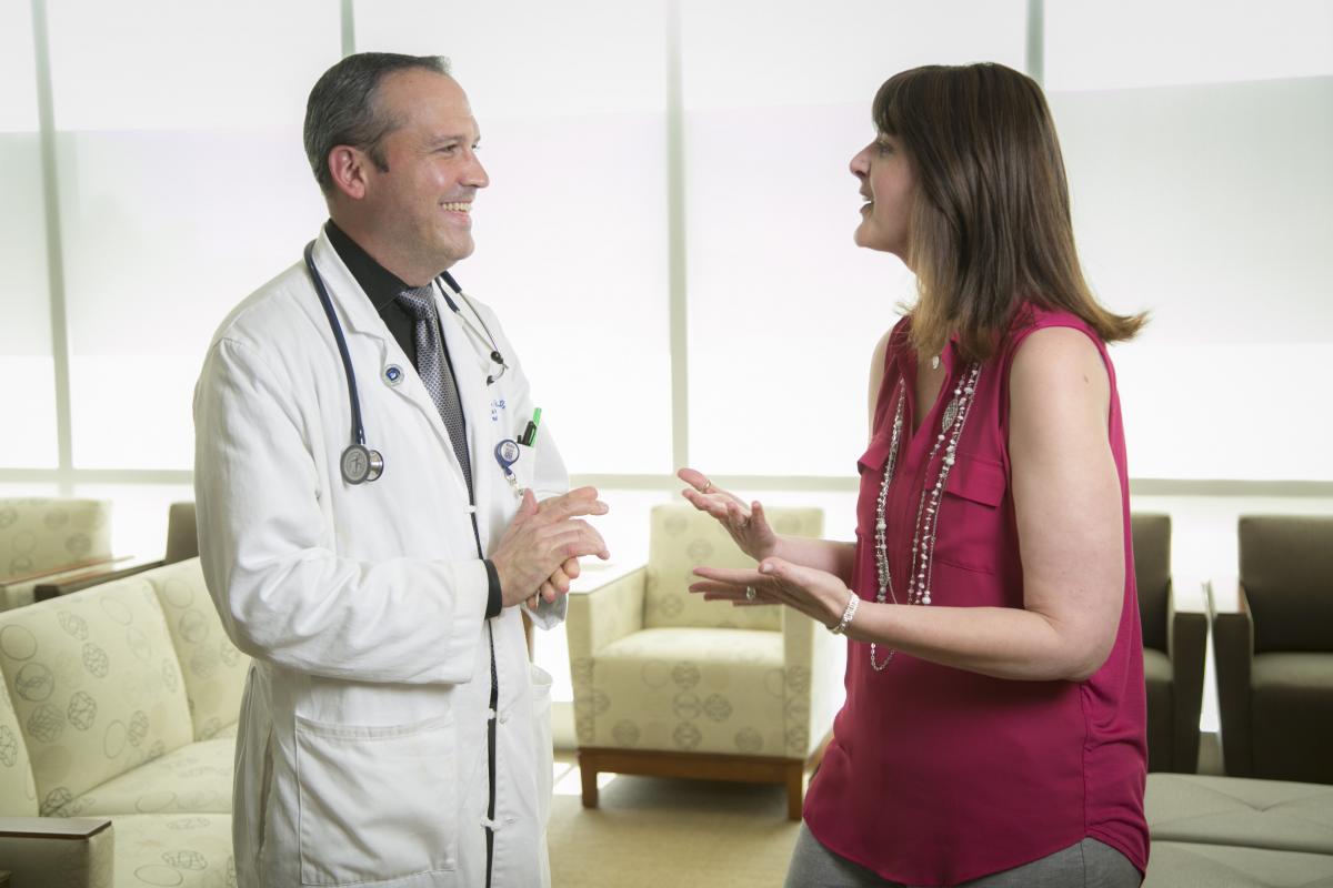 Dr. Brent Hanks having pleasant interaction with patient.